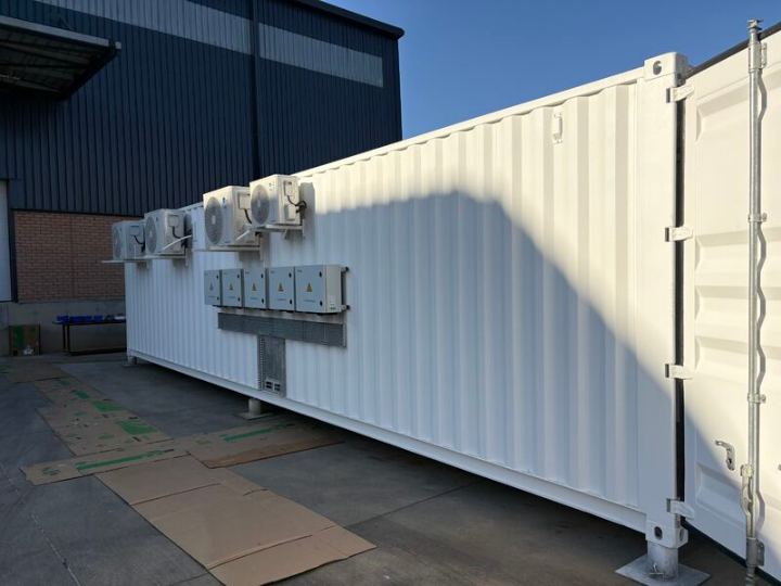 White insulated shipping container fitted as a battery and inverter room