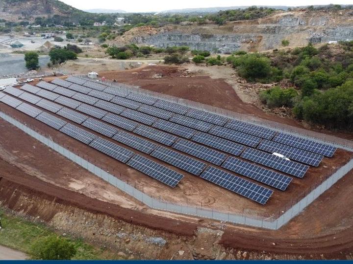 Ground-mounted solar array on a hillside